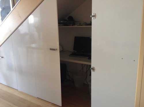 Clever use of under stairs space for office