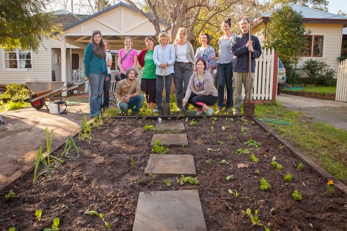Workers pose in front of their labour