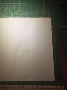 Glue your two sheets together at the centre line. Mark the right hand edge at 6cm.